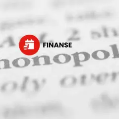 Słowo "monopol" na stronie z finansami, symbolizujące dominację na rynku.