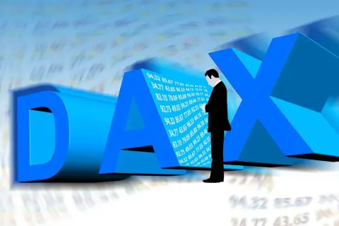 Biznesmen analizujący dax futures notowania. Trójwymiarowe litery DAX i wykresy giełdowe.